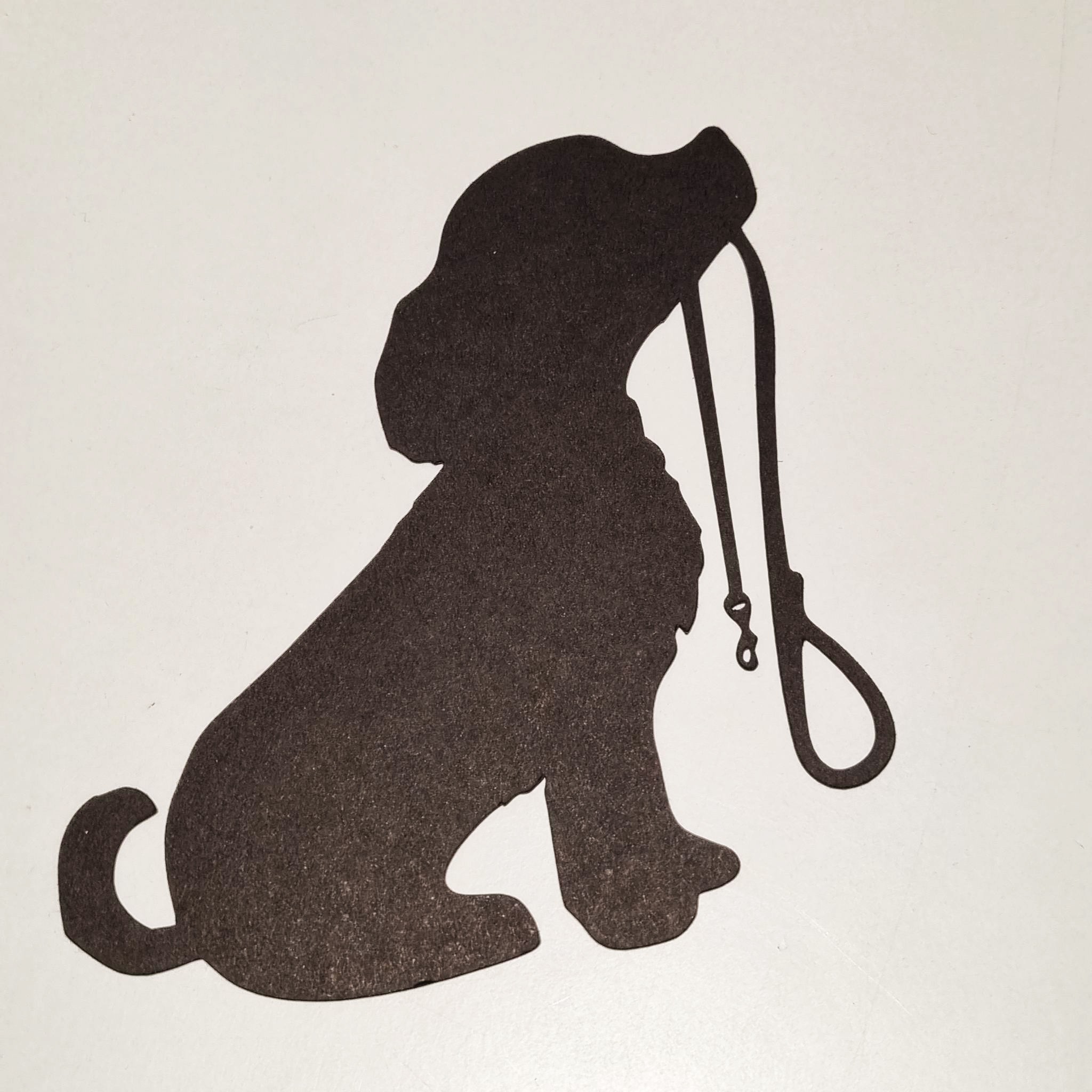 silhouette chien assis avec sa laisse